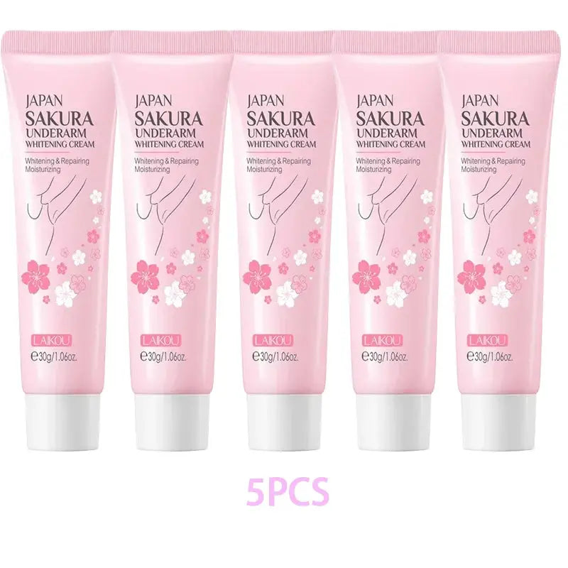 Set of five pink Sakura underarm brightening cream tubes with floral print
