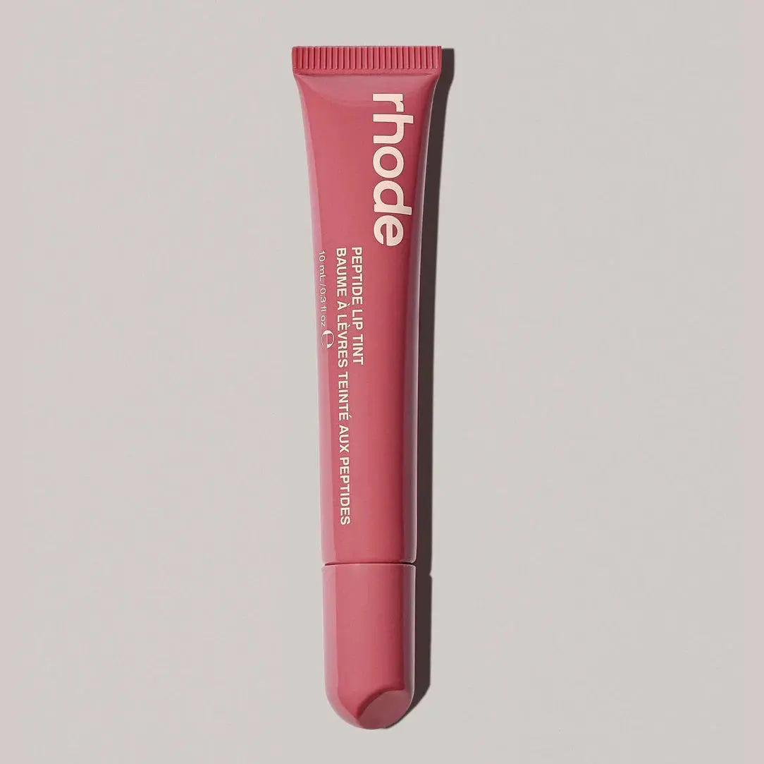 Lip gloss tube, rosy pink shade with ribbed cap and rounded squeeze tip