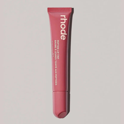 Lip gloss tube, rosy pink shade with ribbed cap and rounded squeeze tip
