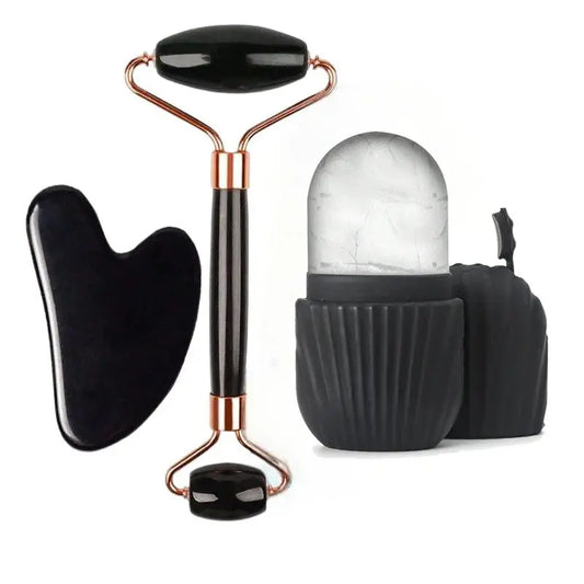 Black facial roller set with rose-gold handle, black gua sha and small roller