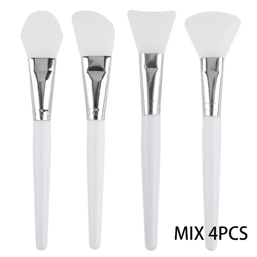 4-piece silicone face mask applicator set with white handles and soft triangular brush heads