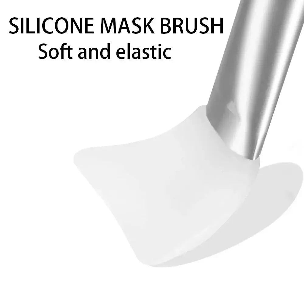 Soft white silicone mask brush head on silver metal applicator handle