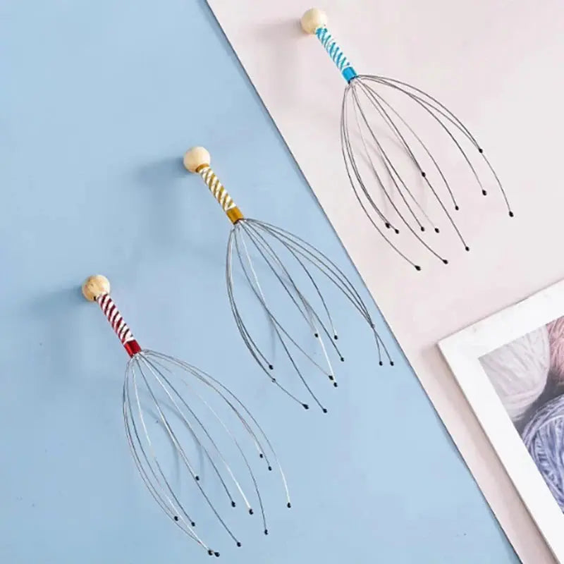 Three octopus head scalp massagers with different braided handles and metal wire tentacles