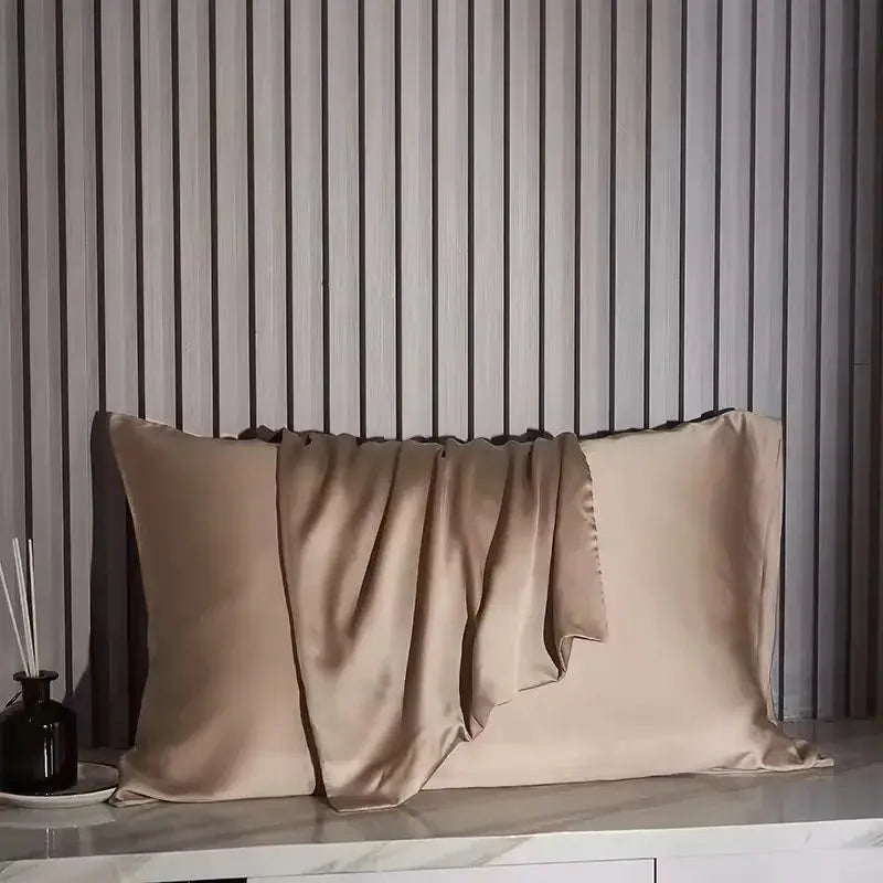 Grey silk pillowcases with smooth satin finish and pleated folded flap