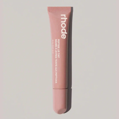 Rhode lip gloss tube in nude beige pink with open applicator tip