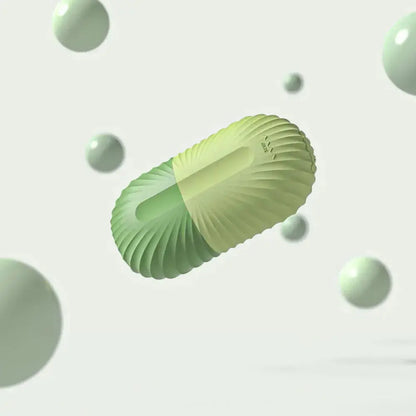 Green silicone ice facial roller close-up with raised grip texture