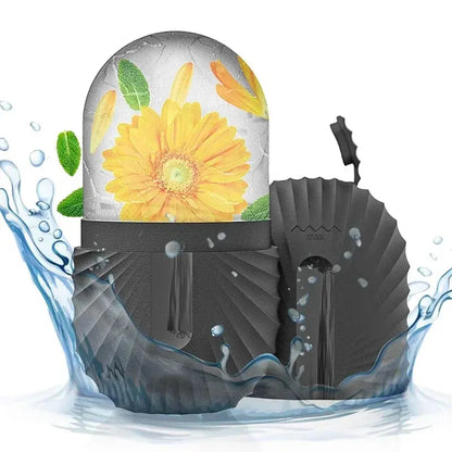 Silicone ice facial roller with dark gray silicone body and yellow flower ice dome