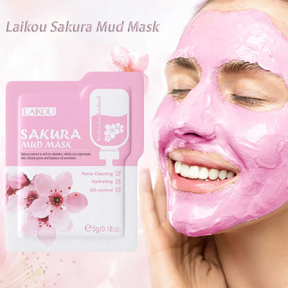 Sakura mud mask face mask sachet and applied pink clay mask on face