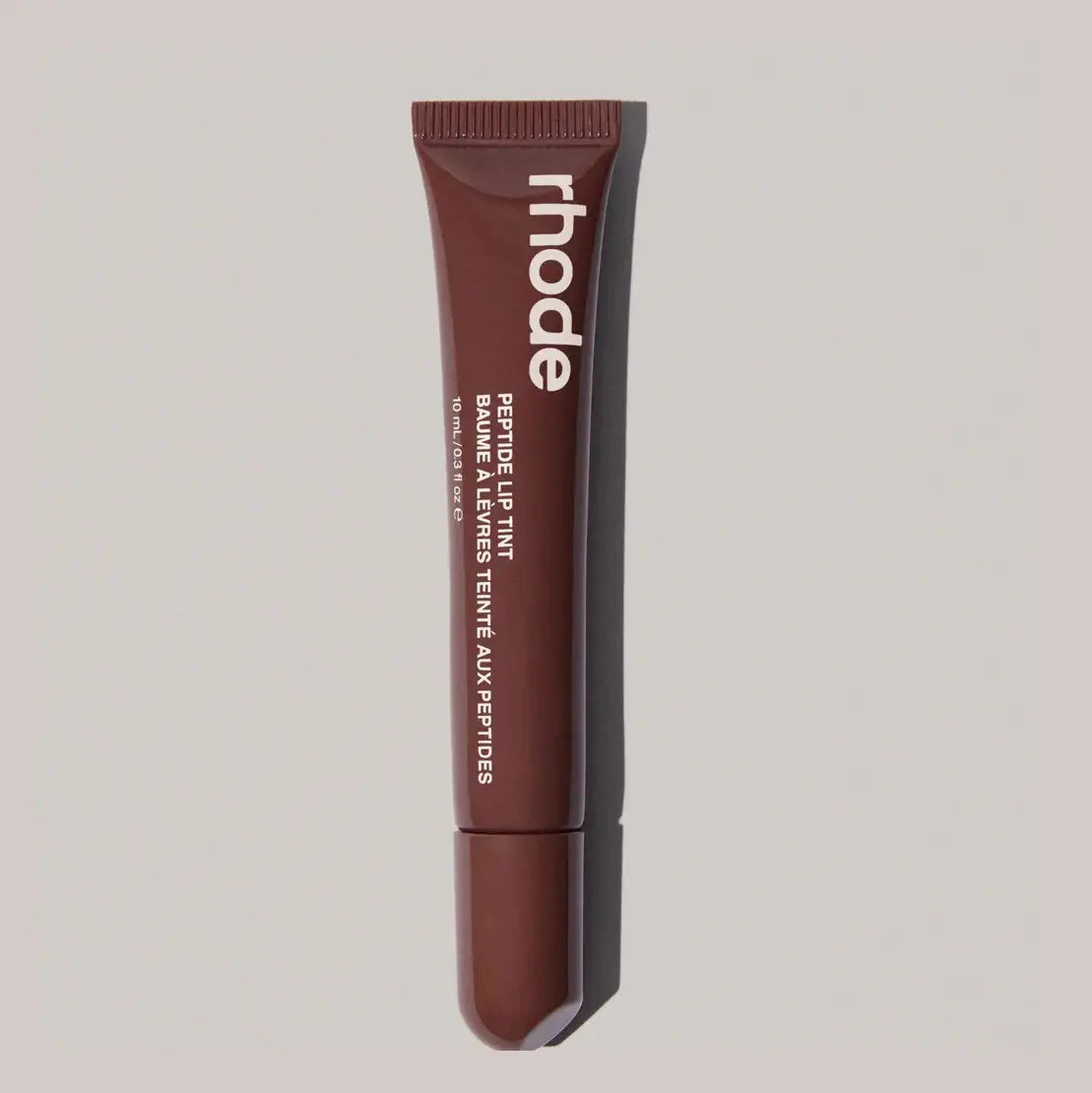 Lip gloss tube, dark brown shade with ribbed cap and squeeze tip
