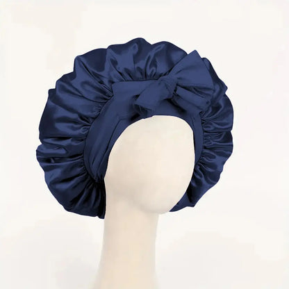 Navy satin sleep bonnet with ruched crown and tie band