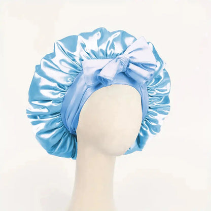 Sky blue satin bonnet with gathered ruffles and front bow tie, adjustable band