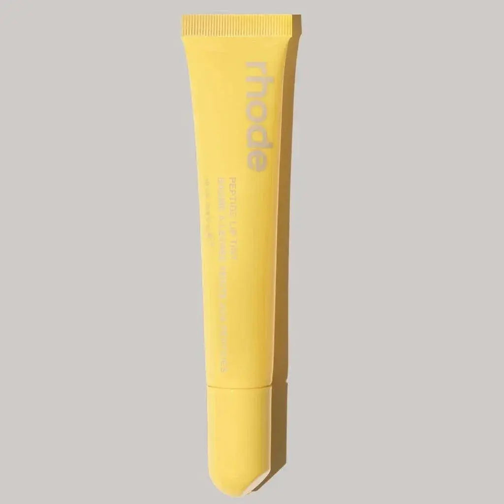 Rhode lip glaze lip gloss in bright yellow tube with applicator tip