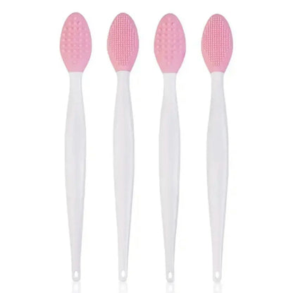 Set of four pink silicone nose cleaning brushes with white handles