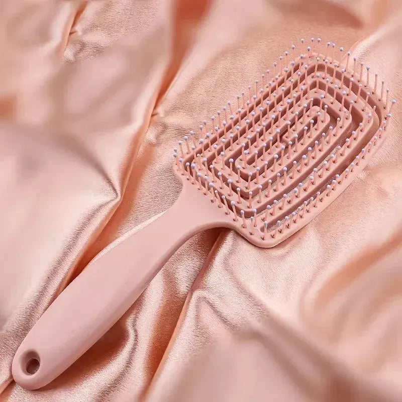 Peach-pink anti-static massage hair brush comb with vented bristle pad and handle