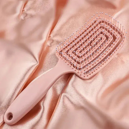 Peach-pink anti-static massage hair brush comb with vented bristle pad and handle