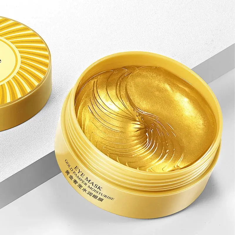 Gold eye mask gel jar, open with glossy gel swirl