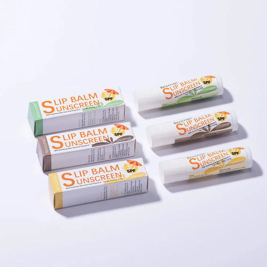 Lip balm SPF 30 stick assortment in green, orange, and beige packaging