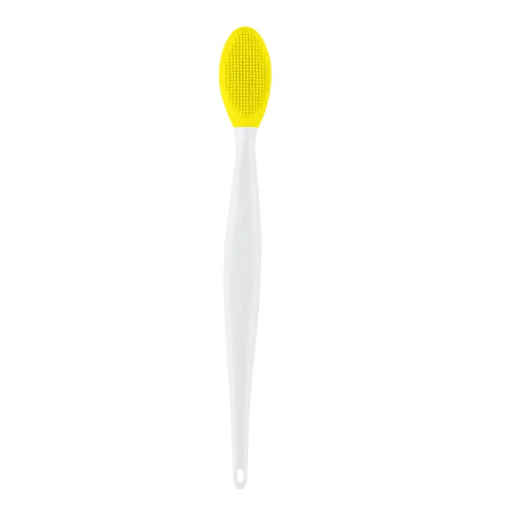 Yellow silicone exfoliating face brush with textured oval head on white handle