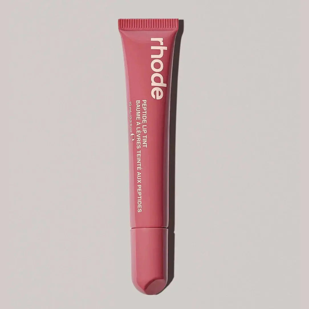 Rhode lip gloss tube in rosy pink with tapered applicator