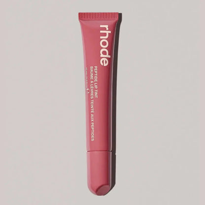 Rhode lip gloss tube in rosy pink with tapered applicator