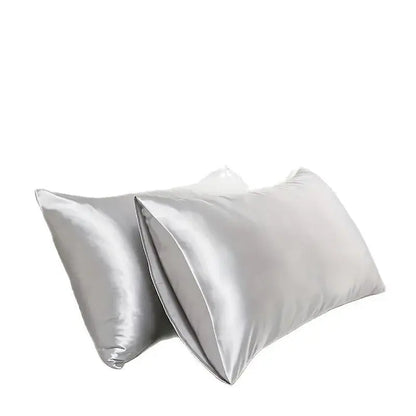 White silk pillowcase set shown open with smooth, glossy surface