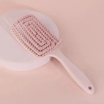 Pink wet hair massage comb brush with handle, anti-static soft bristles.