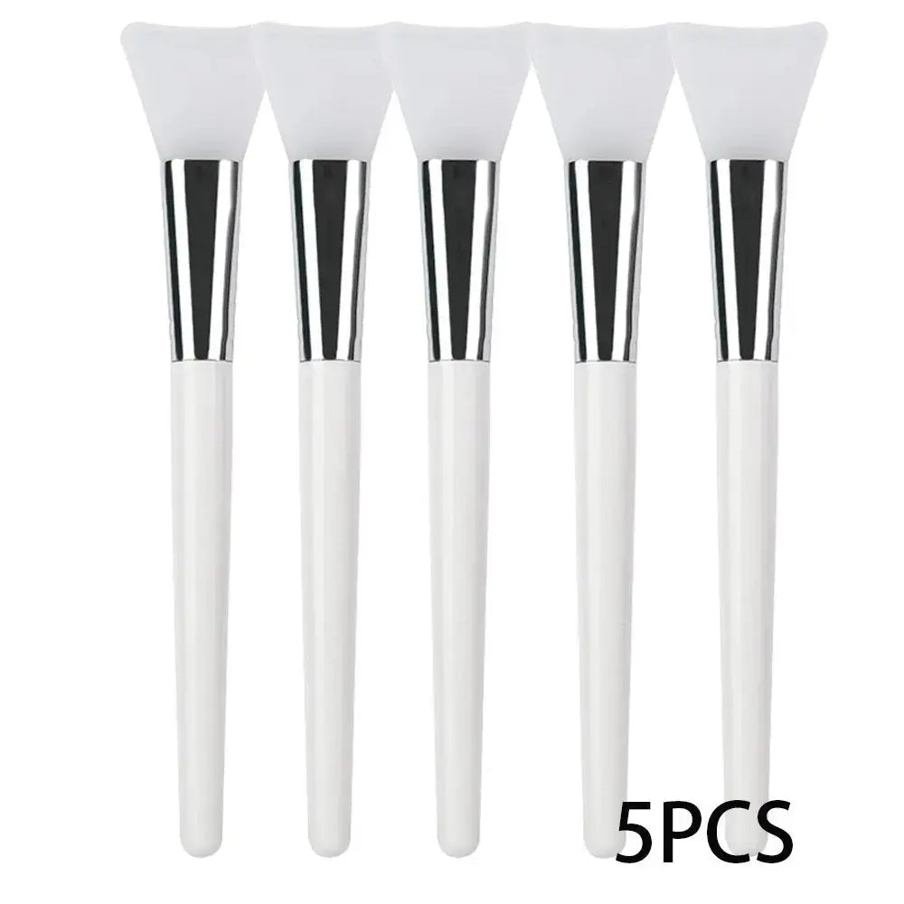 5 silicone face mask applicator brushes with white handles and soft white silicone tips