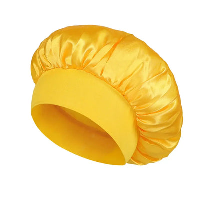 Satin sleeping hair bonnet, wide-brim style in mustard yellow with soft elastic band