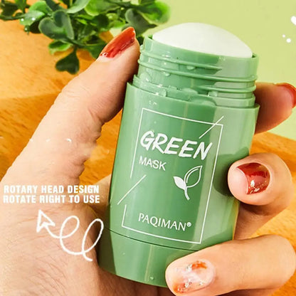 Green tea mask stick container held in hand, green cap and leaf branding