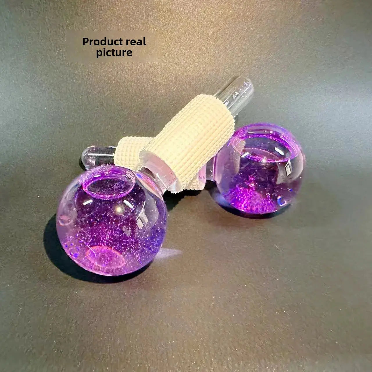 Purple glitter ice crystal ball face and eye rollers with white textured grips, pair