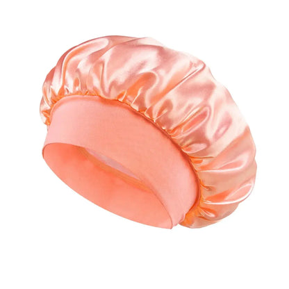 Peach satin sleeping hair bonnet with wide band and gathered top