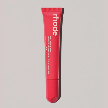 Rhode lip gloss tube in bright red rose pink with open applicator tip