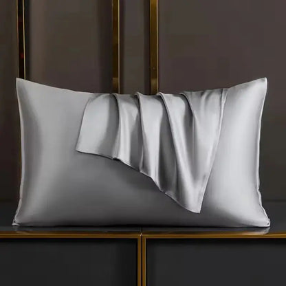 Silver-grey silk pillowcase with draped pleat detail and smooth satin face