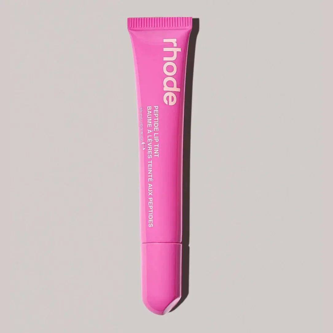 Rhode lip gloss tube in light pink with open applicator tip