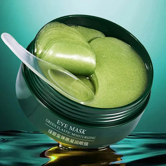 Green eye mask gel jar with white scoop holding gel