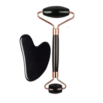 Black silicone face roller with copper-toned metal handle and two gua-sha heads
