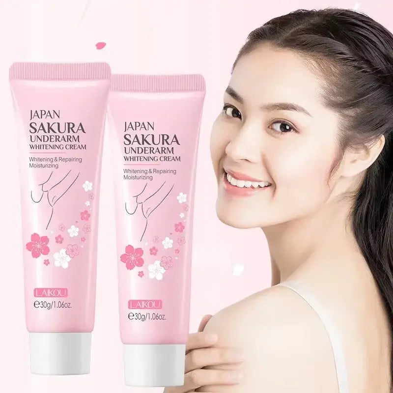 Two pink underarm whitening cream tubes standing side by side