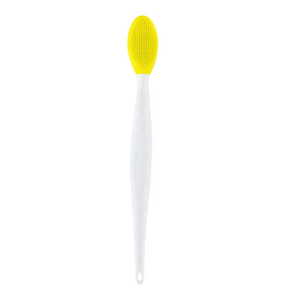 Yellow silicone exfoliating face brush with textured oval head on white handle