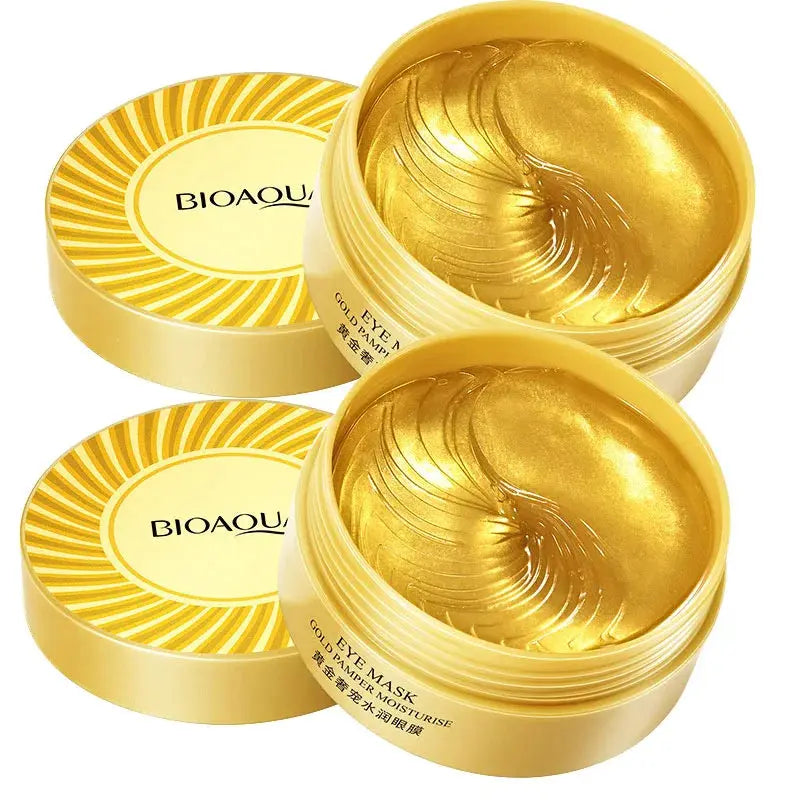 Set of gold eye mask gel jars, open containers with gel
