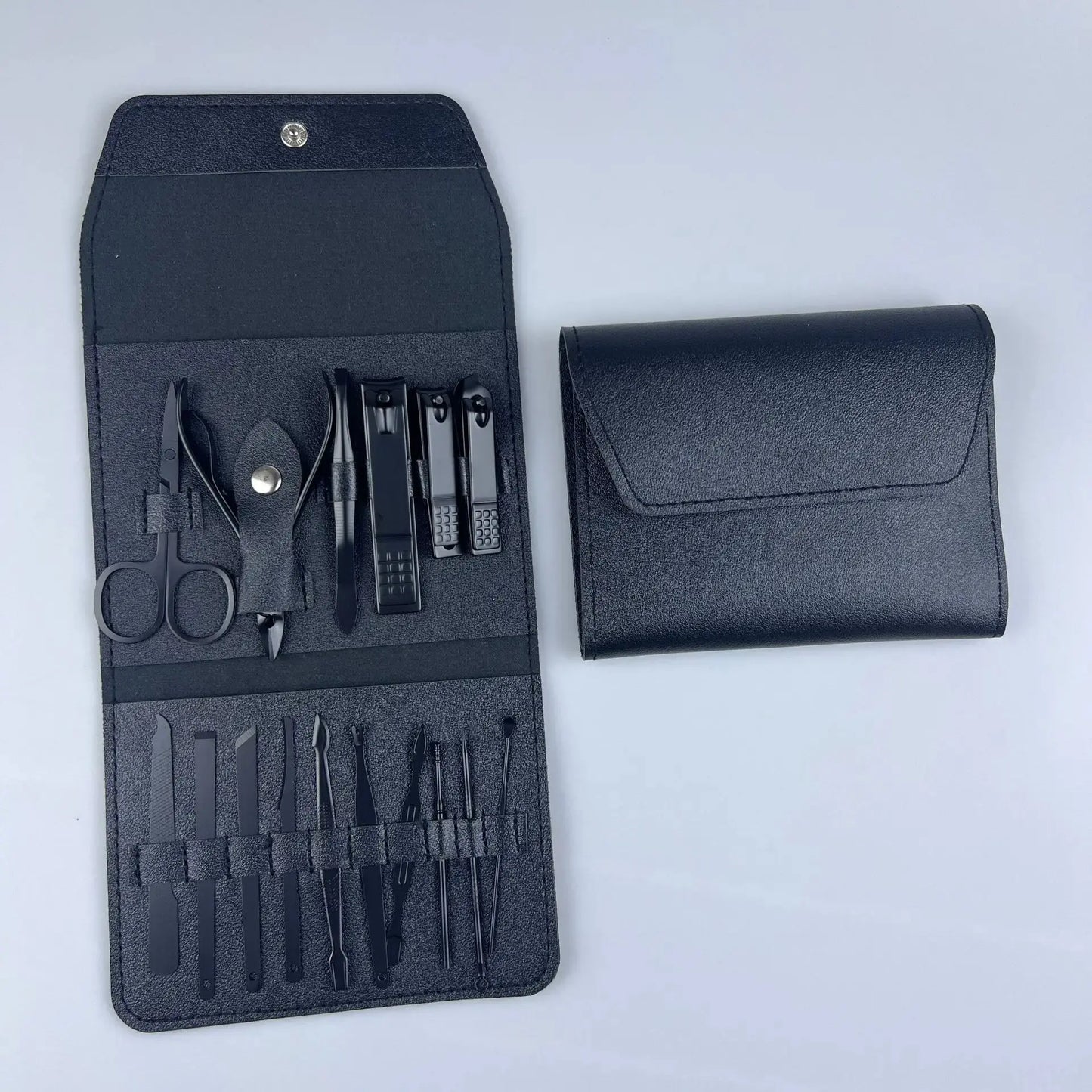 Black nail tool set pouch with clippers, scissors, and files, plus matching case