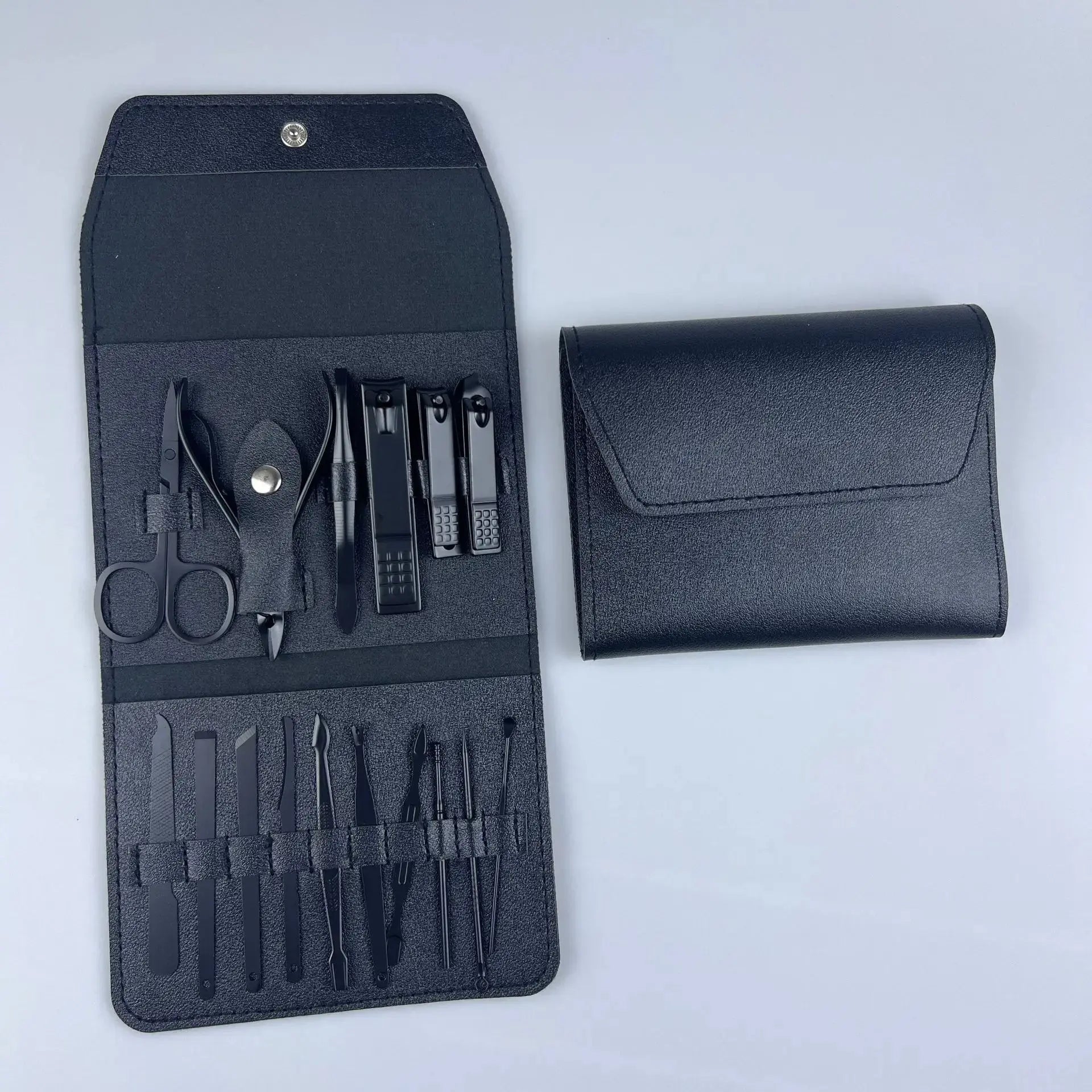 Black nail tool set pouch with clippers, scissors, and files, plus matching case