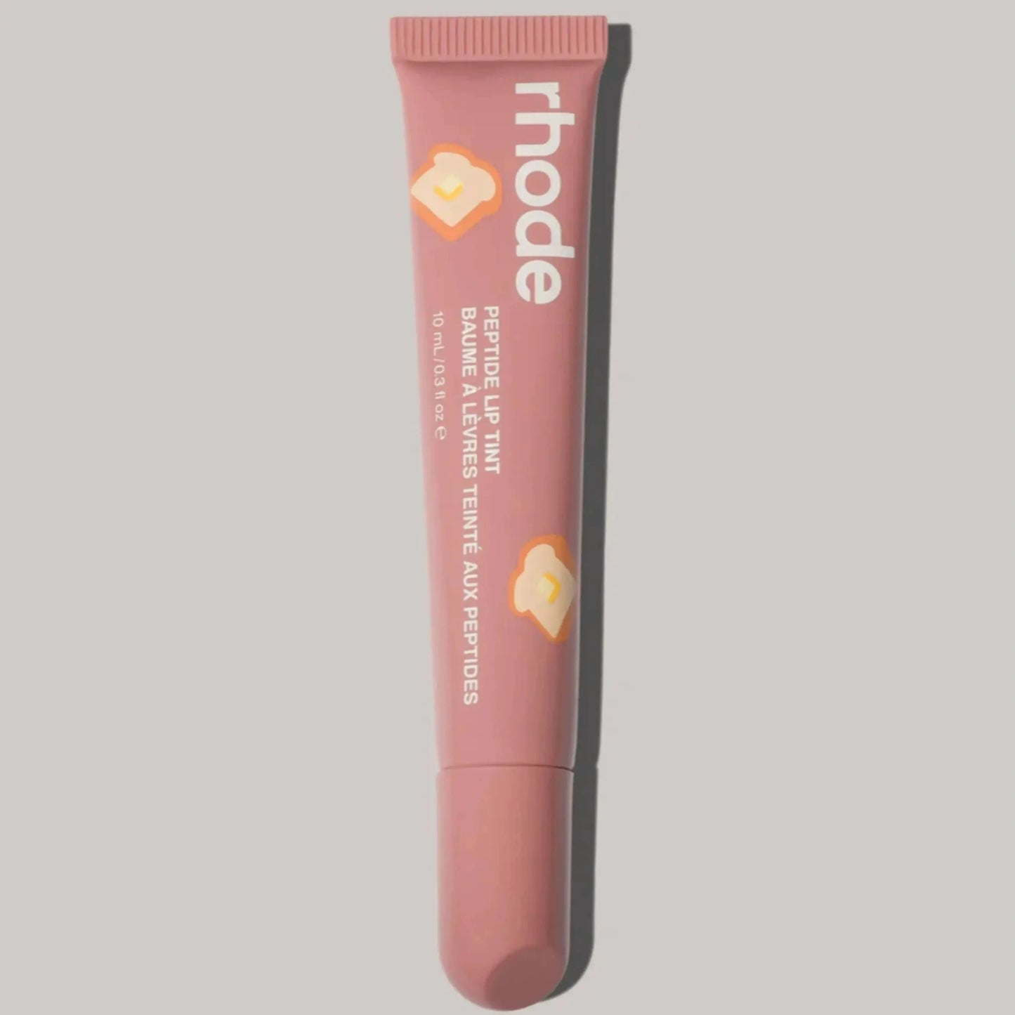 Rhode lip glaze lip gloss in peachy nude tube with heart accents