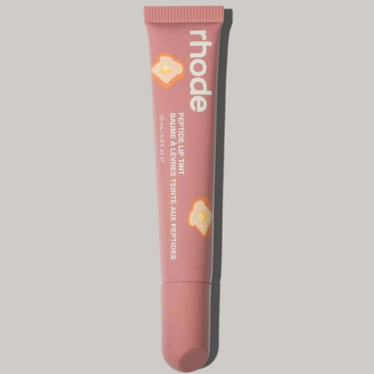Rhode lip glaze lip gloss in peachy nude tube with heart accents