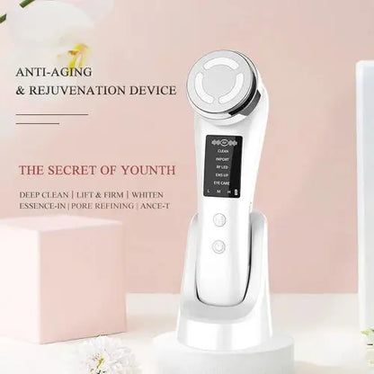 White facial cleansing and rejuvenation device on charging stand, rounded head