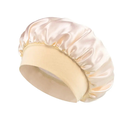Satin hair bonnet for sleeping, light cream wide-brim style with elastic band.