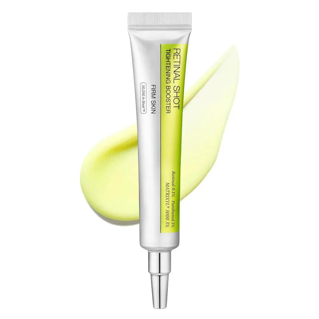 Skincare serum tube, white with green label and silver pump-style cap