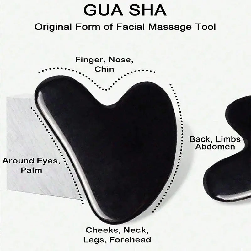 Black gua sha face scraper with heart-shaped massage tool