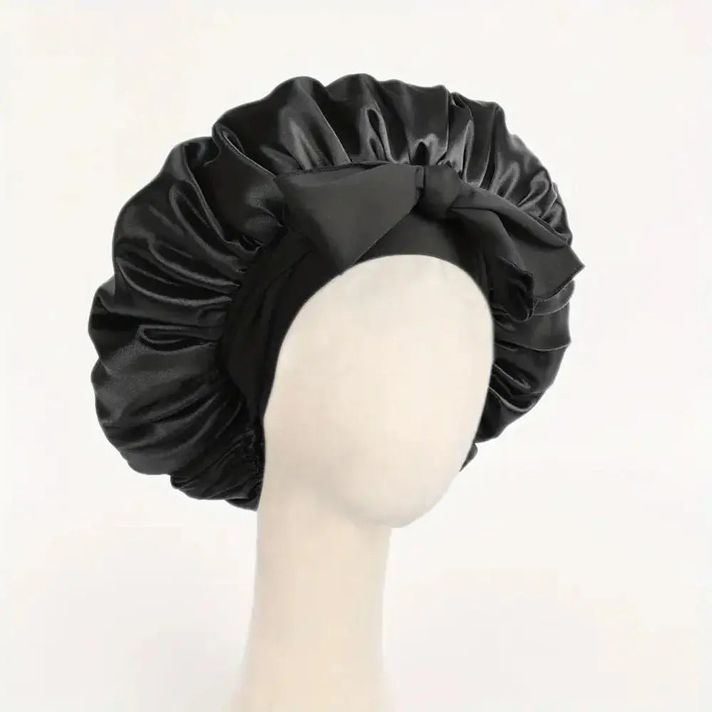Black satin silk sleep bonnet with ruched ruffle edge and adjustable tie band