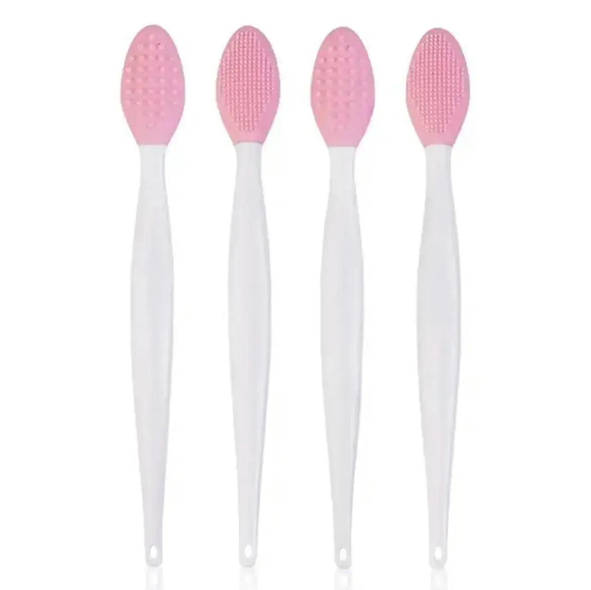 Pink silicone facial cleansing brush set with four white handles and textured heads