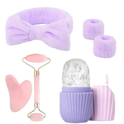 Lavender and pink facial roller set with plush headbands, gua sha and ice rollers